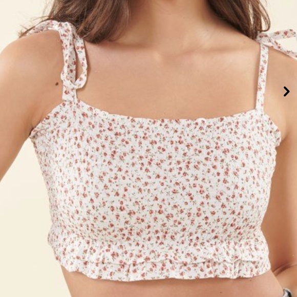 It is a floral cropped top from Garage. - Picture 1 of 1